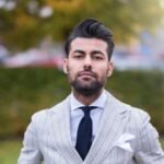 man in white and black pinstripe suit jacket